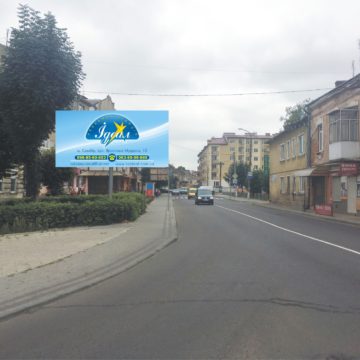 01 -вул. Шевченка, роздоріжжя траси Львів-Ужгород-Мостиська, 100м до центру, сторона Б, на Львів